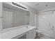 Bright bathroom features a large vanity, shower-tub, and toilet at 3014 Volland Grove Trail, Lawrenceville, GA 30043