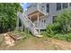 View of deck with stairs descending into the yard, offering easy access to outdoor entertaining areas at 3014 Volland Grove Trail, Lawrenceville, GA 30043