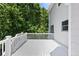 Outdoor deck, ideal for relaxing and enjoying the surrounding nature, features a sturdy railing and ample space at 3014 Volland Grove Trail, Lawrenceville, GA 30043