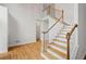 Staircase in the foyer with wood treads and a two-story ceiling at 3014 Volland Grove Trail, Lawrenceville, GA 30043