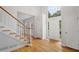 Bright foyer with hardwood floors, staircase, and a two-story entrance at 3014 Volland Grove Trail, Lawrenceville, GA 30043