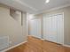 Hallway with hardwood floors and white bi-fold doors at 3014 Volland Grove Trail, Lawrenceville, GA 30043