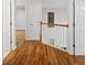 Hallway features hardwood floors, white trim, and access to multiple rooms at 3014 Volland Grove Trail, Lawrenceville, GA 30043