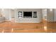 Living room with hardwood floors and built-in shelving for entertainment equipment at 3014 Volland Grove Trail, Lawrenceville, GA 30043