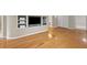 Open living room with hardwood floors and a built-in entertainment center at 3014 Volland Grove Trail, Lawrenceville, GA 30043
