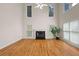 Bright living room with a soaring ceiling, tall windows and a fireplace at 3014 Volland Grove Trail, Lawrenceville, GA 30043