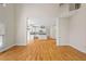 Spacious living room with hardwood floors, high ceilings, and an open view of the modern kitchen at 3014 Volland Grove Trail, Lawrenceville, GA 30043