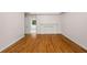 Comfortable living room with hardwood floors, a fireplace, and a doorway leading to the bathroom at 3014 Volland Grove Trail, Lawrenceville, GA 30043