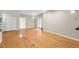 Living room featuring hardwood floors, built-in shelving, and access to the backyard at 3014 Volland Grove Trail, Lawrenceville, GA 30043