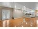 Spacious living room and eat-in kitchen with hardwood floors and stainless steel appliances at 3014 Volland Grove Trail, Lawrenceville, GA 30043