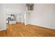 Bright living room featuring hardwood floors, an open layout, and access to the modern kitchen at 3014 Volland Grove Trail, Lawrenceville, GA 30043