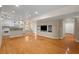 Open living room with hardwood floors connects to the kitchen area at 3014 Volland Grove Trail, Lawrenceville, GA 30043