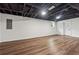 Open basement space with painted ceilings and hardwood floors at 3757 Cindy Dr, Douglasville, GA 30135