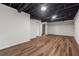 Spacious basement with painted ceilings and hardwood floors at 3757 Cindy Dr, Douglasville, GA 30135