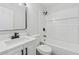 Modern bathroom with white vanity, sleek hardware, and a shower-tub combination, offering a clean and contemporary design at 3757 Cindy Dr, Douglasville, GA 30135