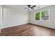 This bedroom features hardwood floors, a ceiling fan and lots of natural light at 3757 Cindy Dr, Douglasville, GA 30135