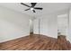 This bedroom features hardwood floors, a ceiling fan and a full ensuite bathroom at 3757 Cindy Dr, Douglasville, GA 30135