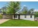 Charming white brick home with a well-manicured lawn and covered carport, perfect for suburban living at 3757 Cindy Dr, Douglasville, GA 30135