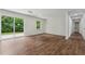 Bright and airy living space with wood floors, large sliding glass doors, and easy access to a side hall at 3757 Cindy Dr, Douglasville, GA 30135