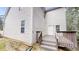 Exterior shot of a home's backyard featuring a wooden deck and yard at 4912 Lightwood Nw Ct, Acworth, GA 30102
