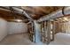 Unfinished basement showing utilities and framing with concrete floor ready for customization at 4912 Lightwood Nw Ct, Acworth, GA 30102