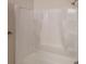 Bathroom featuring a white shower and tub with built in shelves at 4912 Lightwood Nw Ct, Acworth, GA 30102