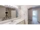 Bathroom vanity featuring a large mirror and sink with chrome hardware at 4912 Lightwood Nw Ct, Acworth, GA 30102