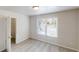 Bedroom with neutral carpet, a window, and a closet for ample storage at 4912 Lightwood Nw Ct, Acworth, GA 30102