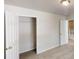 Bright bedroom with an open closet showing great storage space and neutral carpet at 4912 Lightwood Nw Ct, Acworth, GA 30102