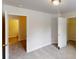 Bedroom featuring a closet, door to another room, and neutral carpet at 4912 Lightwood Nw Ct, Acworth, GA 30102