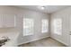 Dining area with new vinyl flooring and a white trim and lots of natural light at 4912 Lightwood Nw Ct, Acworth, GA 30102