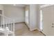 Open entryway featuring natural light, stairs with white railing, and neutral walls with wood trim at 4912 Lightwood Nw Ct, Acworth, GA 30102
