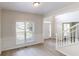 Bright, airy entryway with wood floors, a staircase, and views into the adjoining living and dining areas at 4912 Lightwood Nw Ct, Acworth, GA 30102
