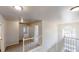 Upstairs hallway with carpeting, neutral walls, and lots of natural light from a window at 4912 Lightwood Nw Ct, Acworth, GA 30102
