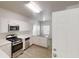 Kitchen featuring stainless steel appliances, light countertops and a door leading outside at 4912 Lightwood Nw Ct, Acworth, GA 30102