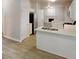 Modern kitchen with white cabinets, stainless steel appliances, and an island with a sink at 4912 Lightwood Nw Ct, Acworth, GA 30102