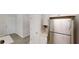 Bright kitchen featuring stainless steel refrigerator and white cabinets at 4912 Lightwood Nw Ct, Acworth, GA 30102
