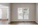 Living room with hardwood floors and a window that lets in plenty of natural light at 4912 Lightwood Nw Ct, Acworth, GA 30102