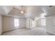 Spacious main bedroom with tray ceilings, fan, and neutral carpet at 4912 Lightwood Nw Ct, Acworth, GA 30102