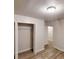 Bedroom featuring neutral walls, a closet with open doors, and wood laminate flooring at 7125 Puckett Sw St, Covington, GA 30014