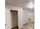 Bedroom with wood-look floors showcasing an open closet at 7125 Puckett Sw St, Covington, GA 30014