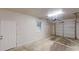 Spacious garage featuring a roll-up door, and a secondary entry door at 7125 Puckett Sw St, Covington, GA 30014
