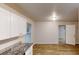 Kitchen area boasts modern cabinetry and flooring, with natural light streaming in at 7125 Puckett Sw St, Covington, GA 30014