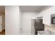 Kitchen area with stainless steel refrigerator and modern countertops at 7125 Puckett Sw St, Covington, GA 30014