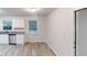 Bright kitchen featuring white cabinets, granite countertops, and modern stainless steel appliances at 7125 Puckett Sw St, Covington, GA 30014