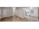 Open living space showcasing new floors, crisp white walls, and access to the kitchen at 7125 Puckett Sw St, Covington, GA 30014
