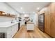 Stylish kitchen featuring white cabinets, stainless steel appliances, and a butcher block island at 9545 Kingston Crossing Cir, Alpharetta, GA 30022