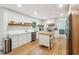 Modern kitchen featuring stainless steel appliances, white subway tiles, and a wood-top island at 9545 Kingston Crossing Cir, Alpharetta, GA 30022