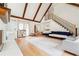 Spacious living area with high ceilings, wood floors, and a staircase leading to the upper level at 9545 Kingston Crossing Cir, Alpharetta, GA 30022