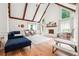 Bright living room featuring vaulted ceilings, exposed beams, and a cozy fireplace at 9545 Kingston Crossing Cir, Alpharetta, GA 30022